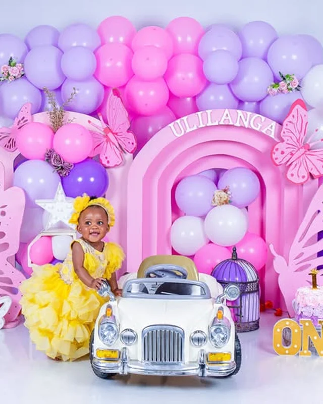 Birthday photoshoot, toy car and pink arch backdrop