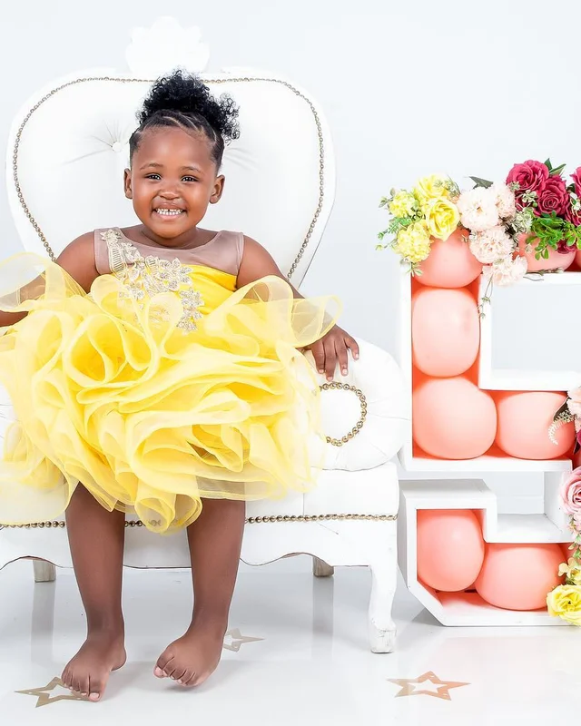 Birthday photoshoot in a yellow tutu, throne chair
