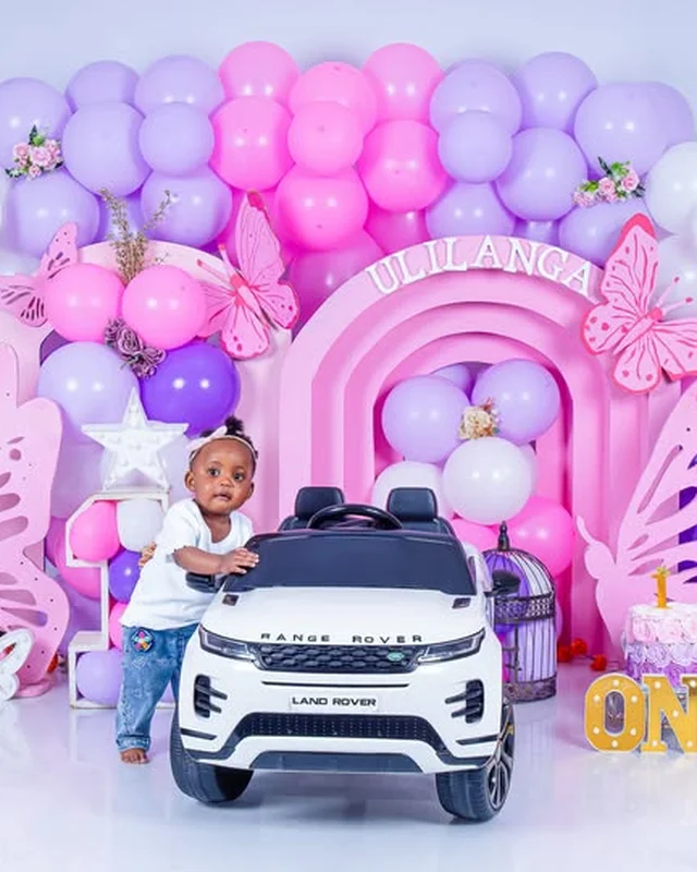 Birthday photoshoot, toy car and lilac balloon arch
