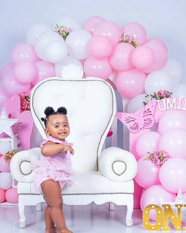First birthday photoshoot, throne chair and pink balloon arch